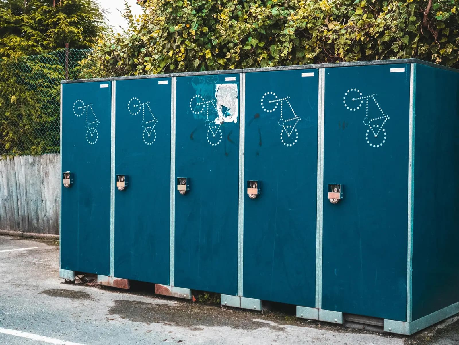 Secure outdoor bike lockers with individual locking compartments for bicycle storage