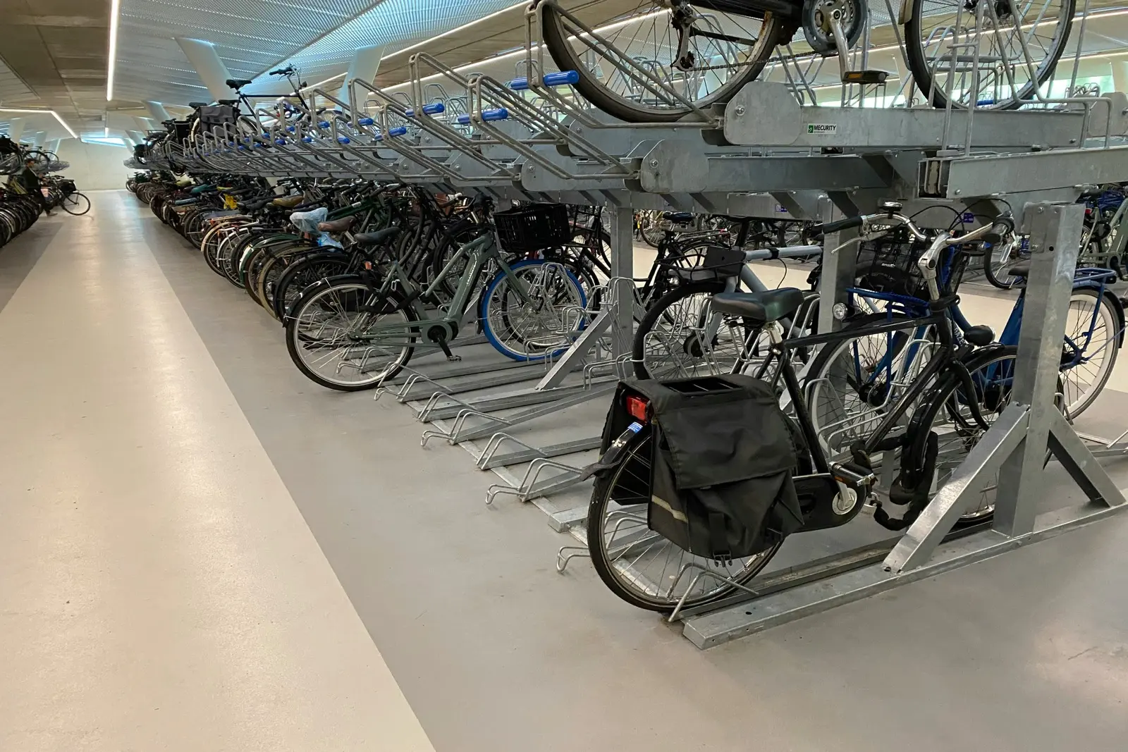 Two-tier bike rack system installed in Toronto multi-residential bike room compliant with Toronto bylaw 569-2013